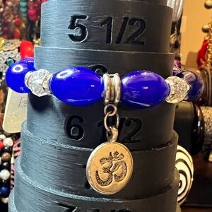 Vibrant Blue Beaded Bracelet with Om Pendant